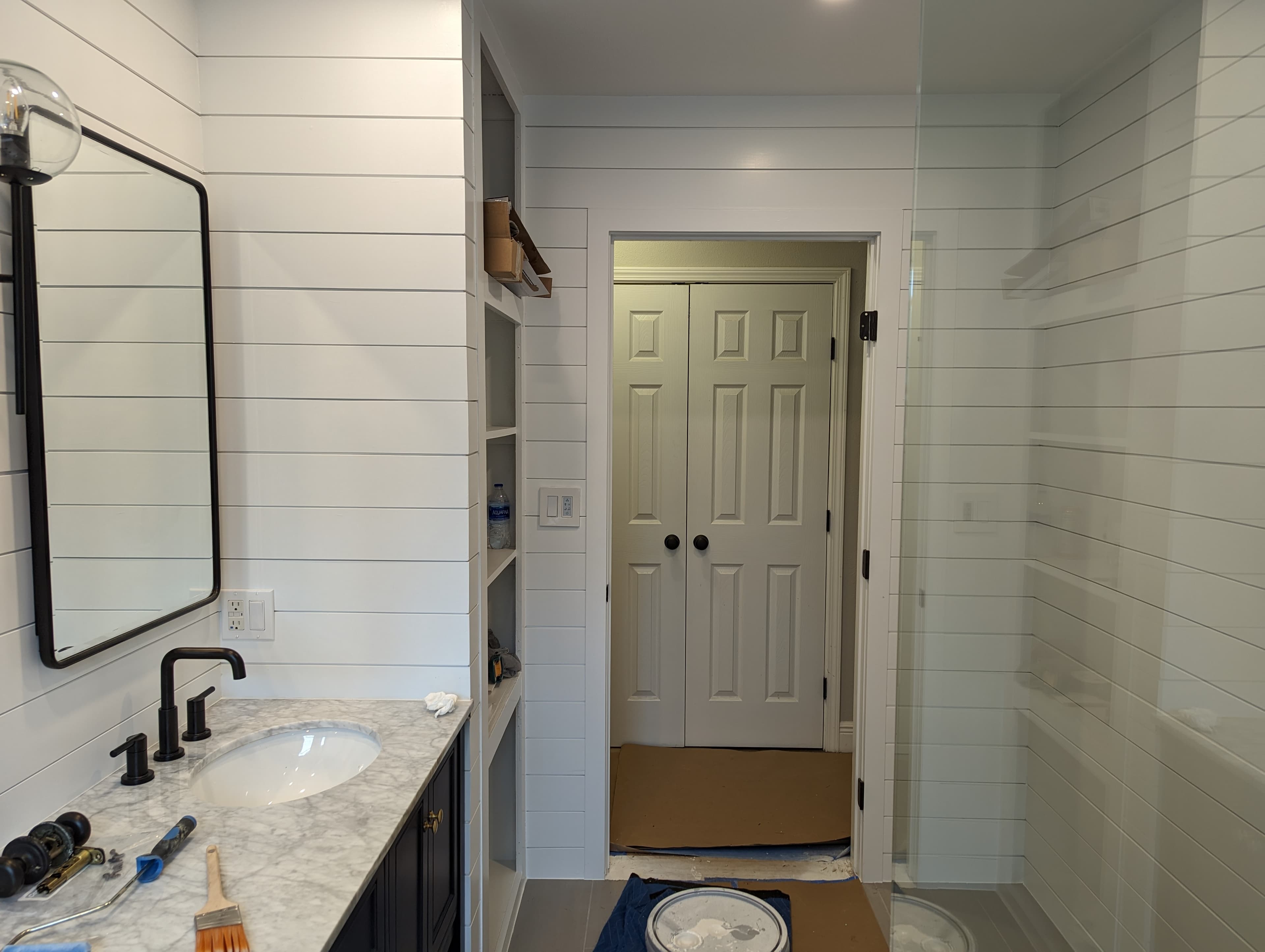 Professional bathroom remodel project featuring bathroom renovation shiplap marble vanity progress