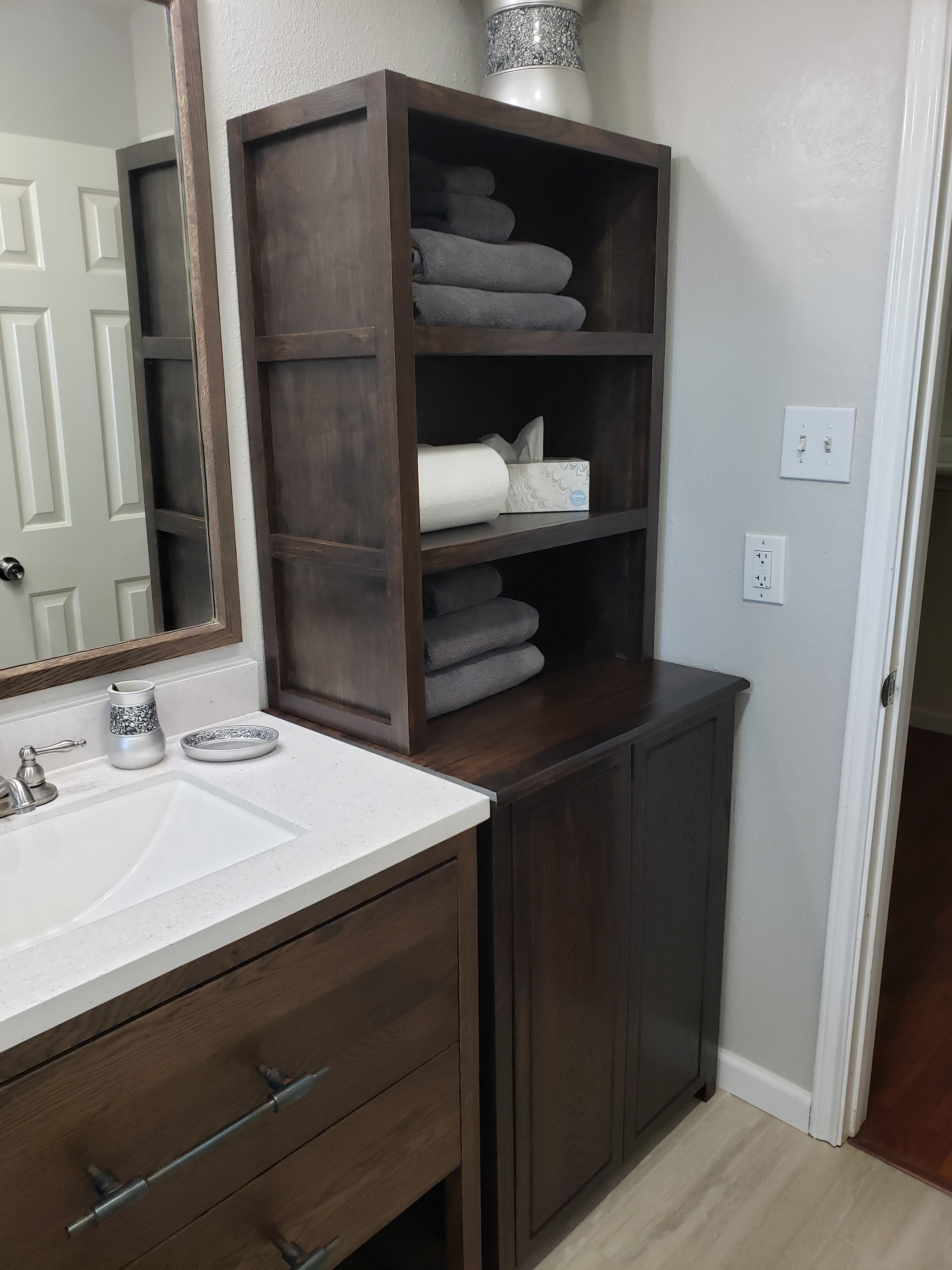 Professional bathroom remodel project featuring custom bathroom vanity pull out drawers organization
