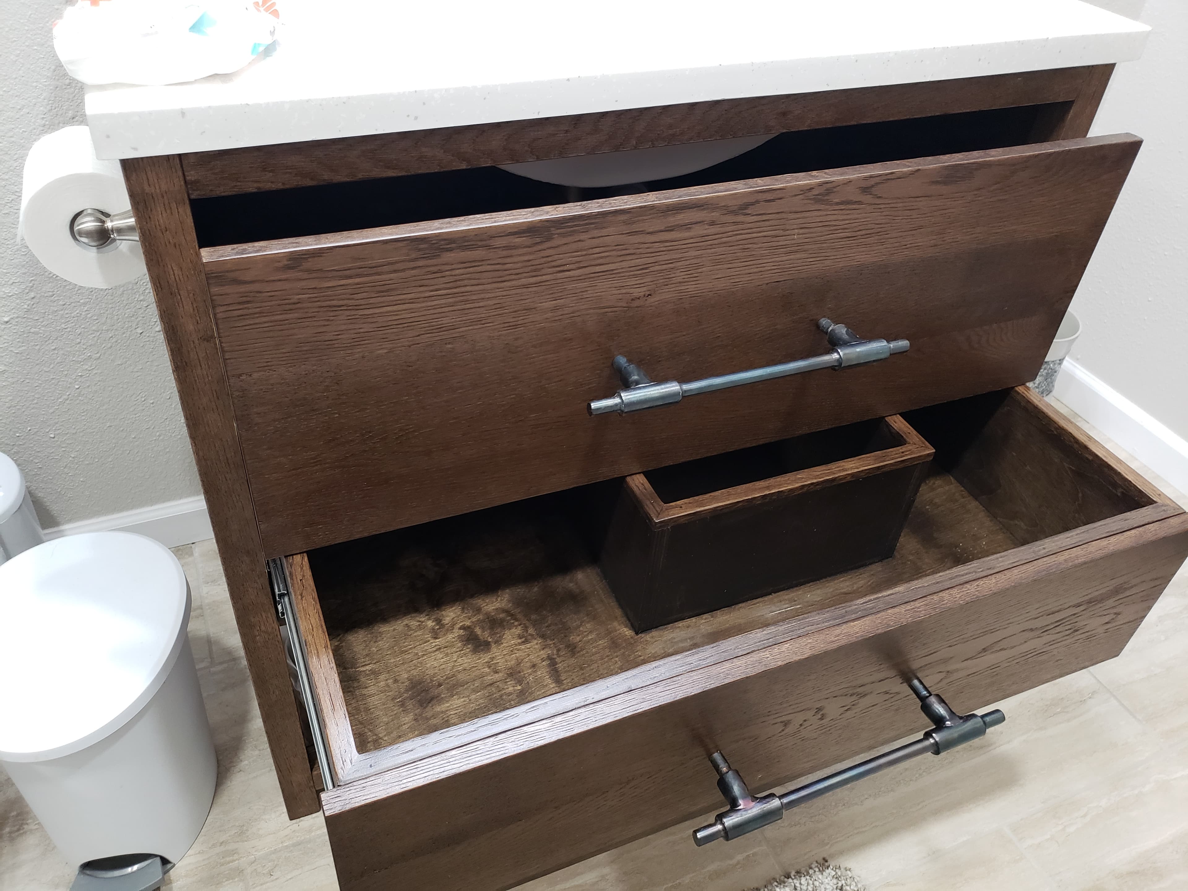 Professional bathroom remodel project featuring custom bathroom vanity walnut drawers storage