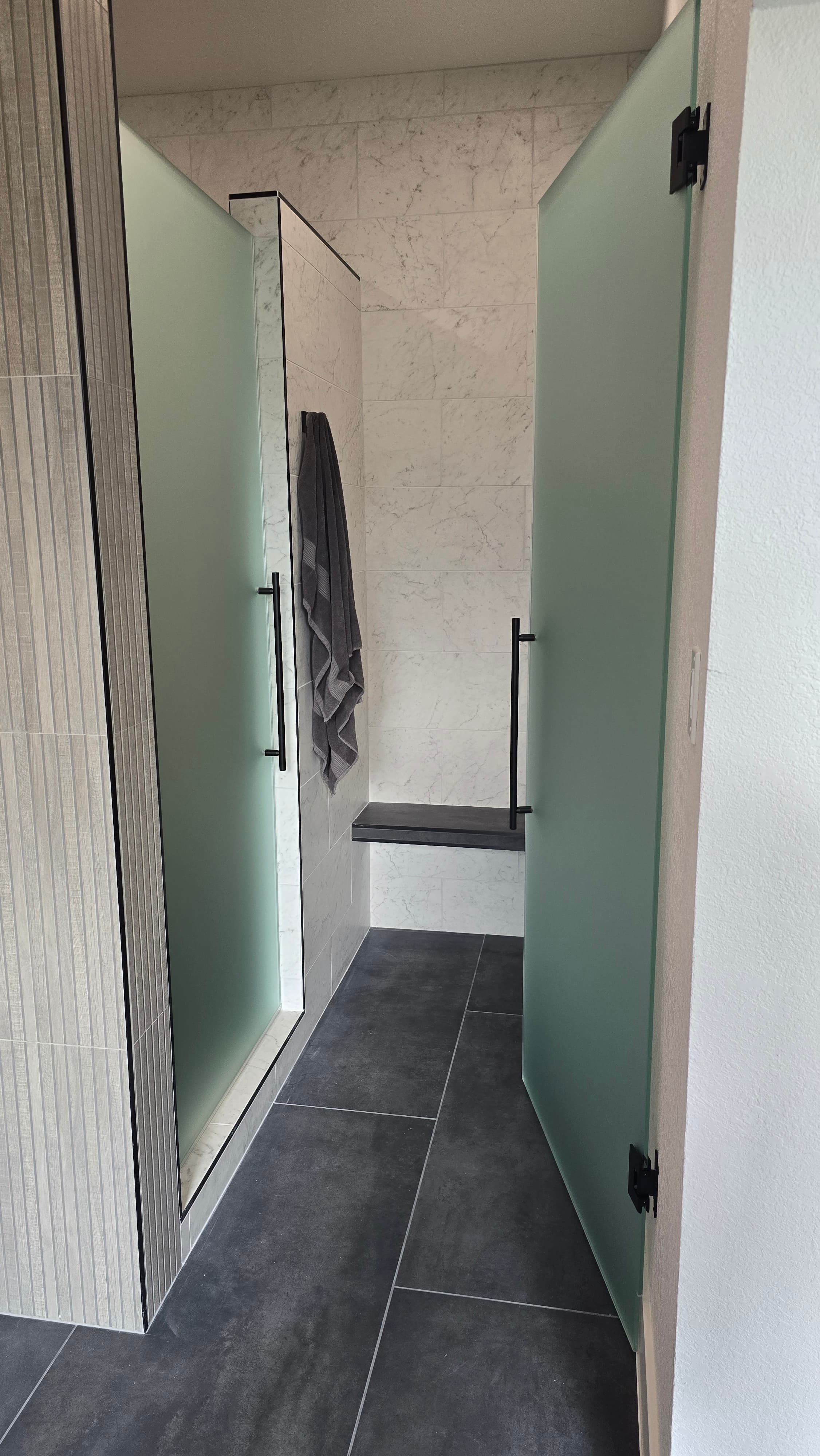 Professional bathroom remodel project featuring luxury bathroom led lighting large format tile