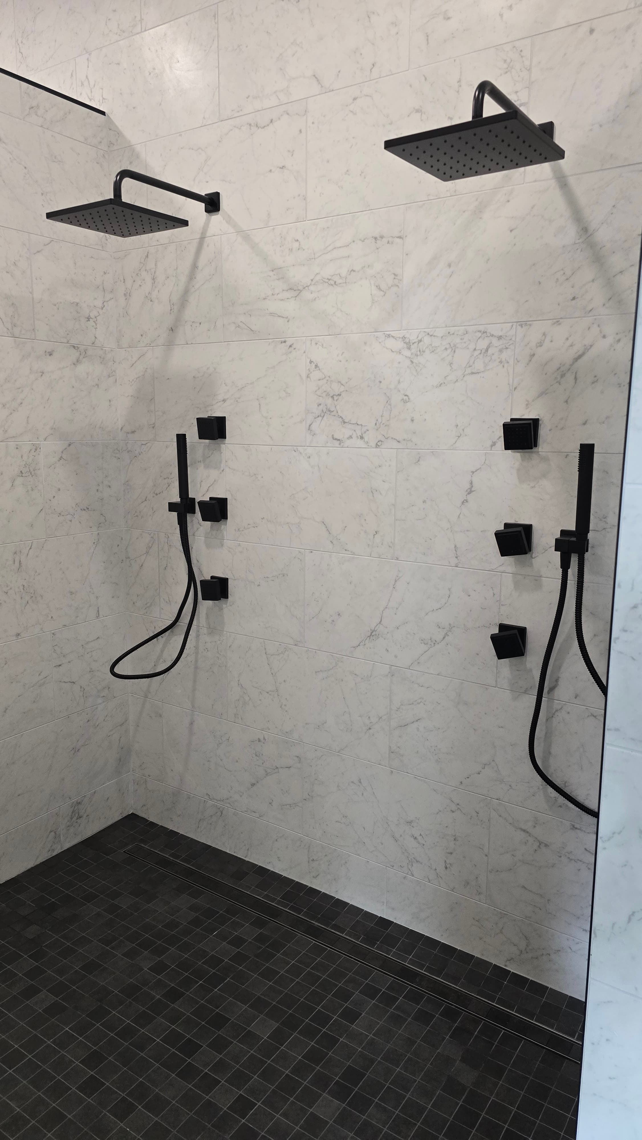 Professional bathroom remodel project featuring modern bathroom glass shower black fixtures