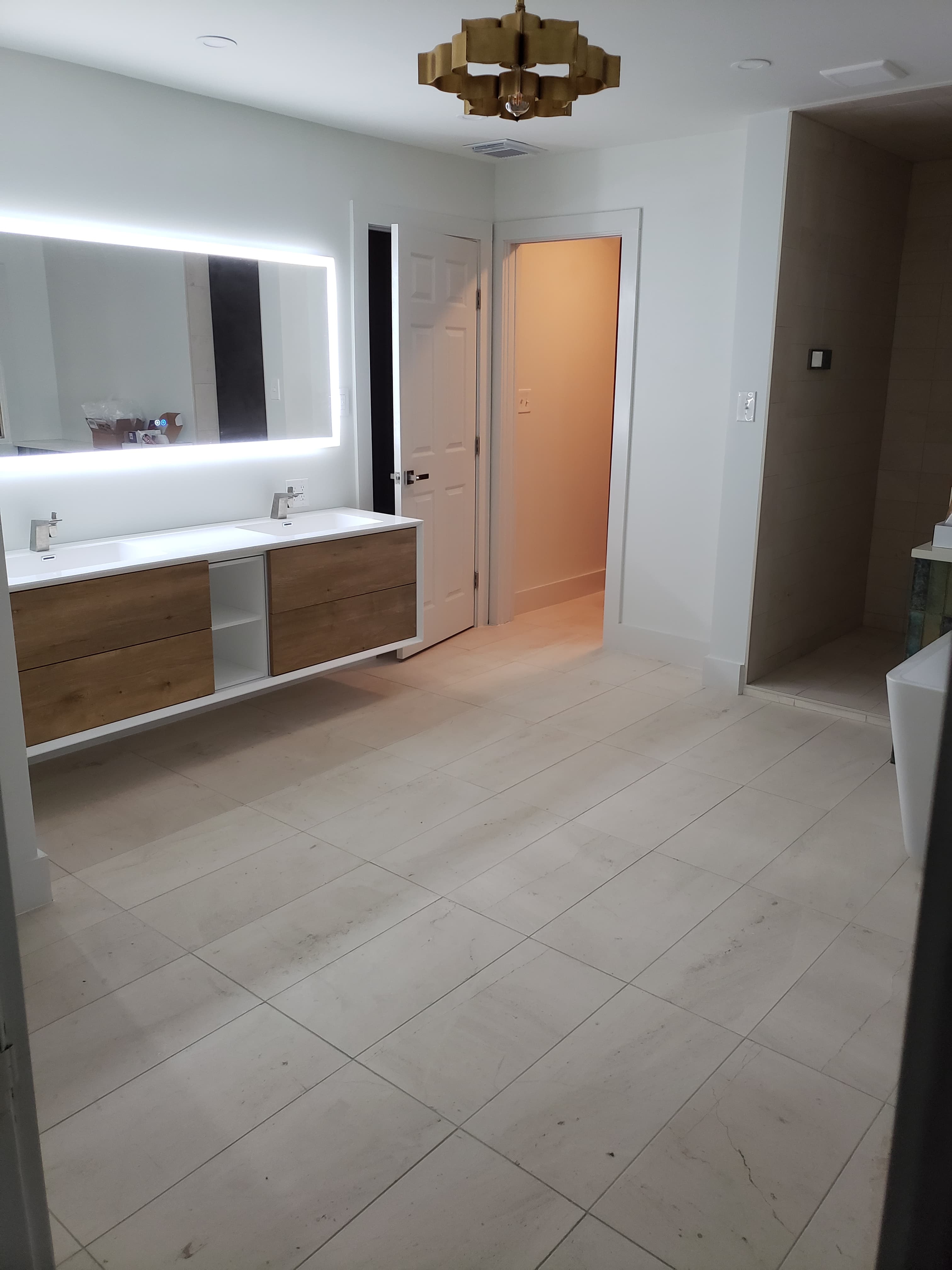 Professional bathroom remodel project featuring modern bathroom led mirror