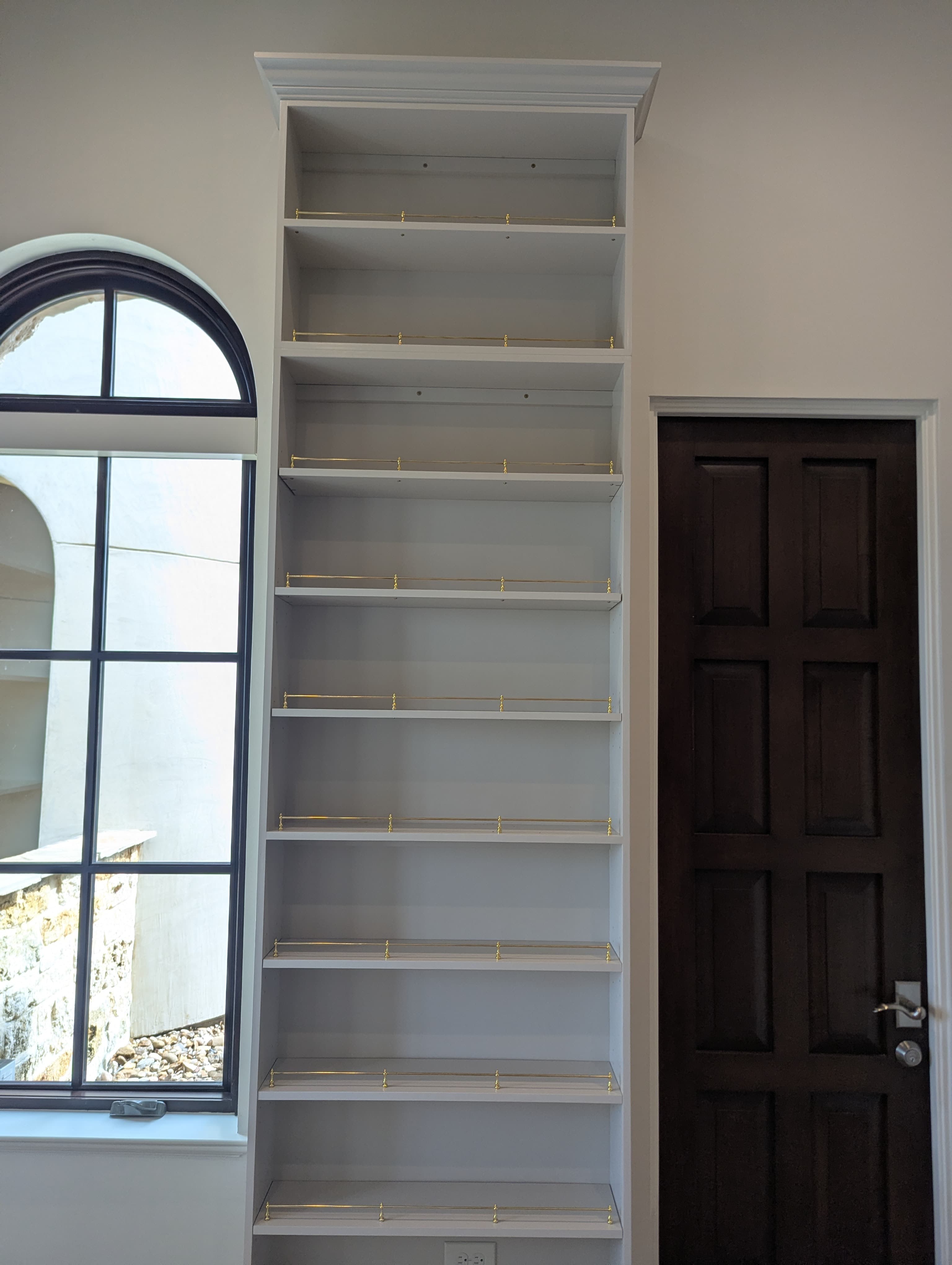 Built-In Library, Tall Bookcase by Arched Window in Boerne, TX