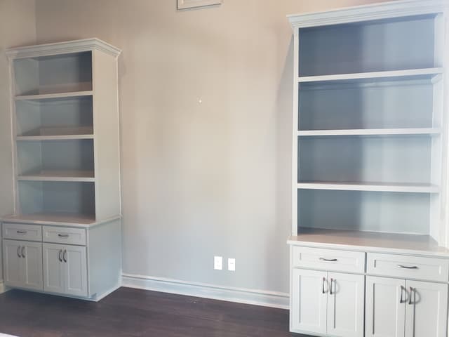 Custom built-in white bookcases with adjustable shelving San Antonio