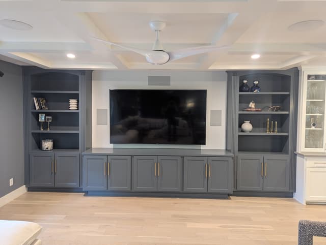 Built-in entertainment center with arched open shelving San Antonio