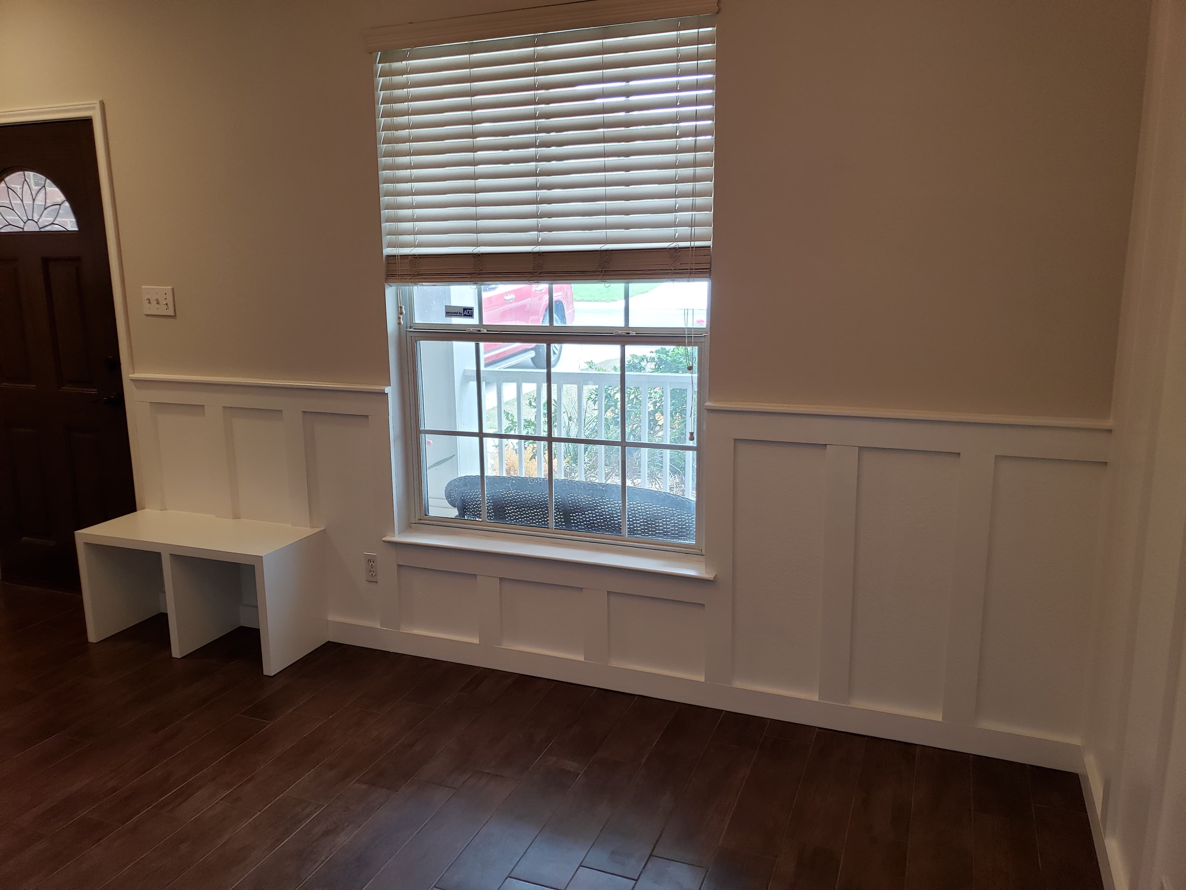 Custom built-in window seat with storage and wainscoting - San Antonio TX
