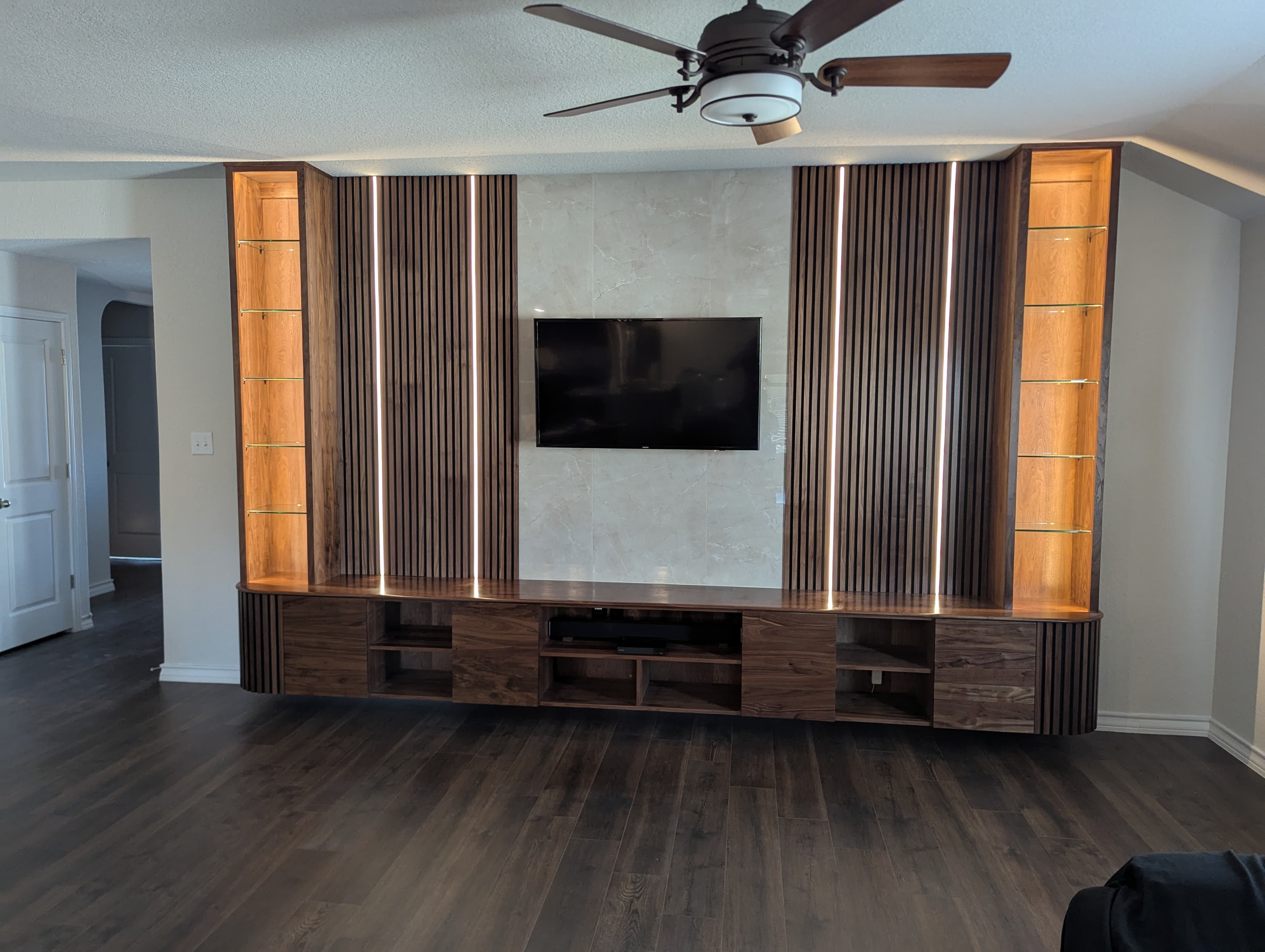Walnut Media Wall With Floating Console in Alamo Ranch, San Antonio, TX