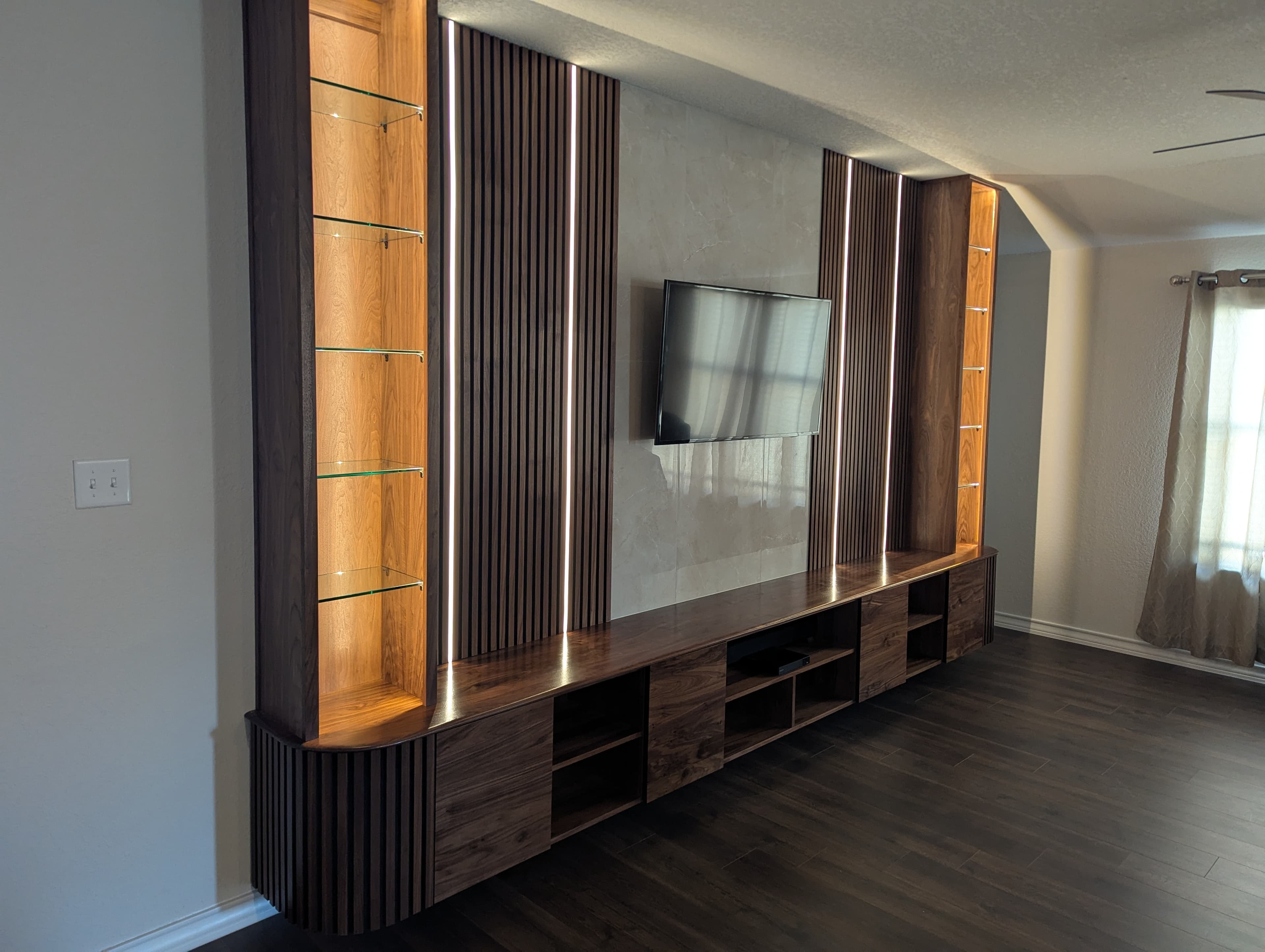 Walnut Media Wall, Lit Glass-Shelf Tower in Alamo Ranch, San Antonio, TX