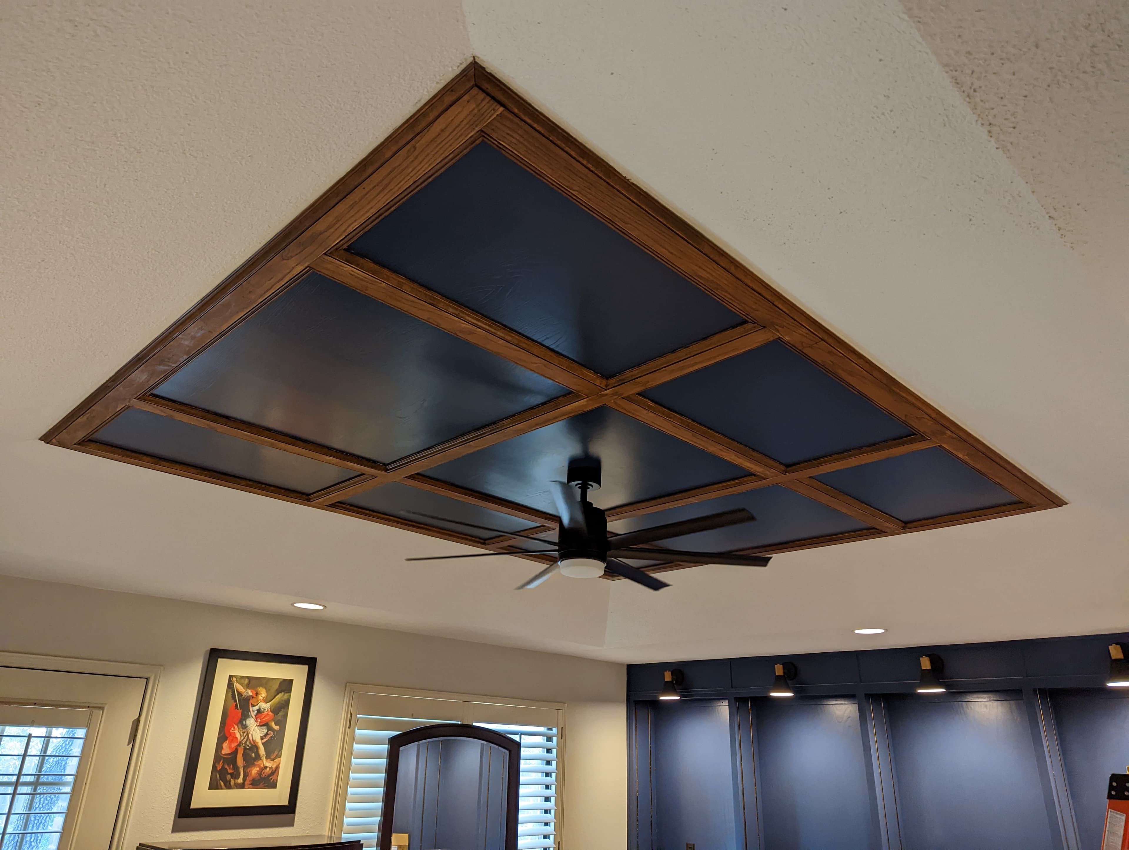 Custom coffered ceiling with wood trim and ceiling fan - San Antonio carpentry
