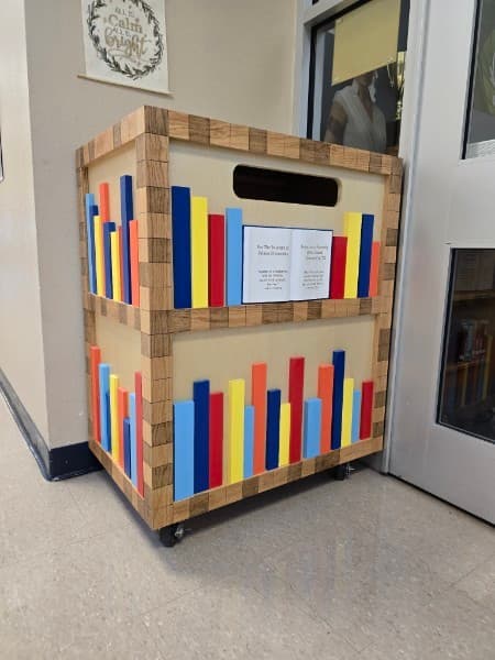 Custom mobile library cart with book spine design - San Antonio carpentry
