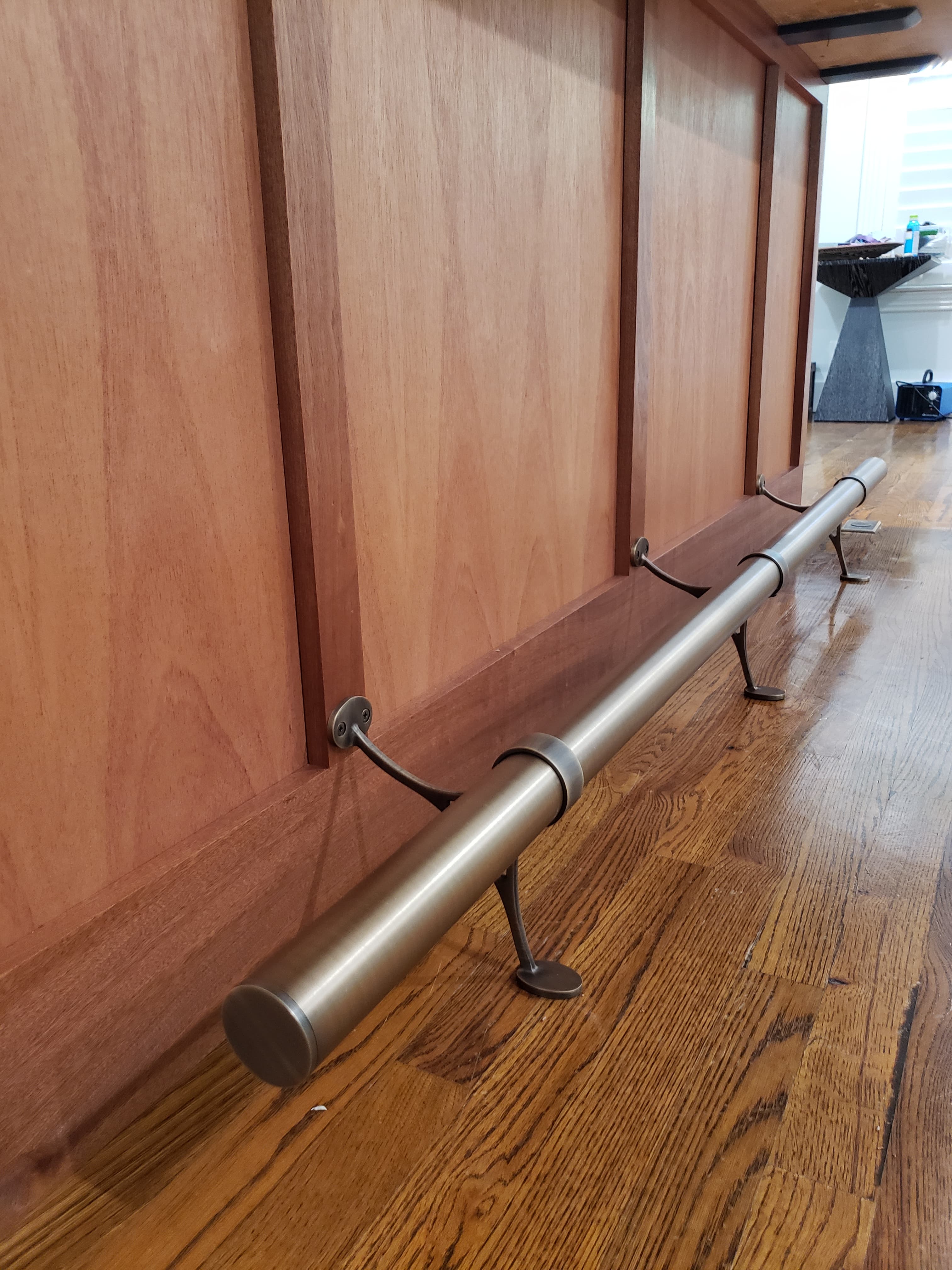 Custom staircase with cherry wood treads and steel handrail - San Antonio carpentry