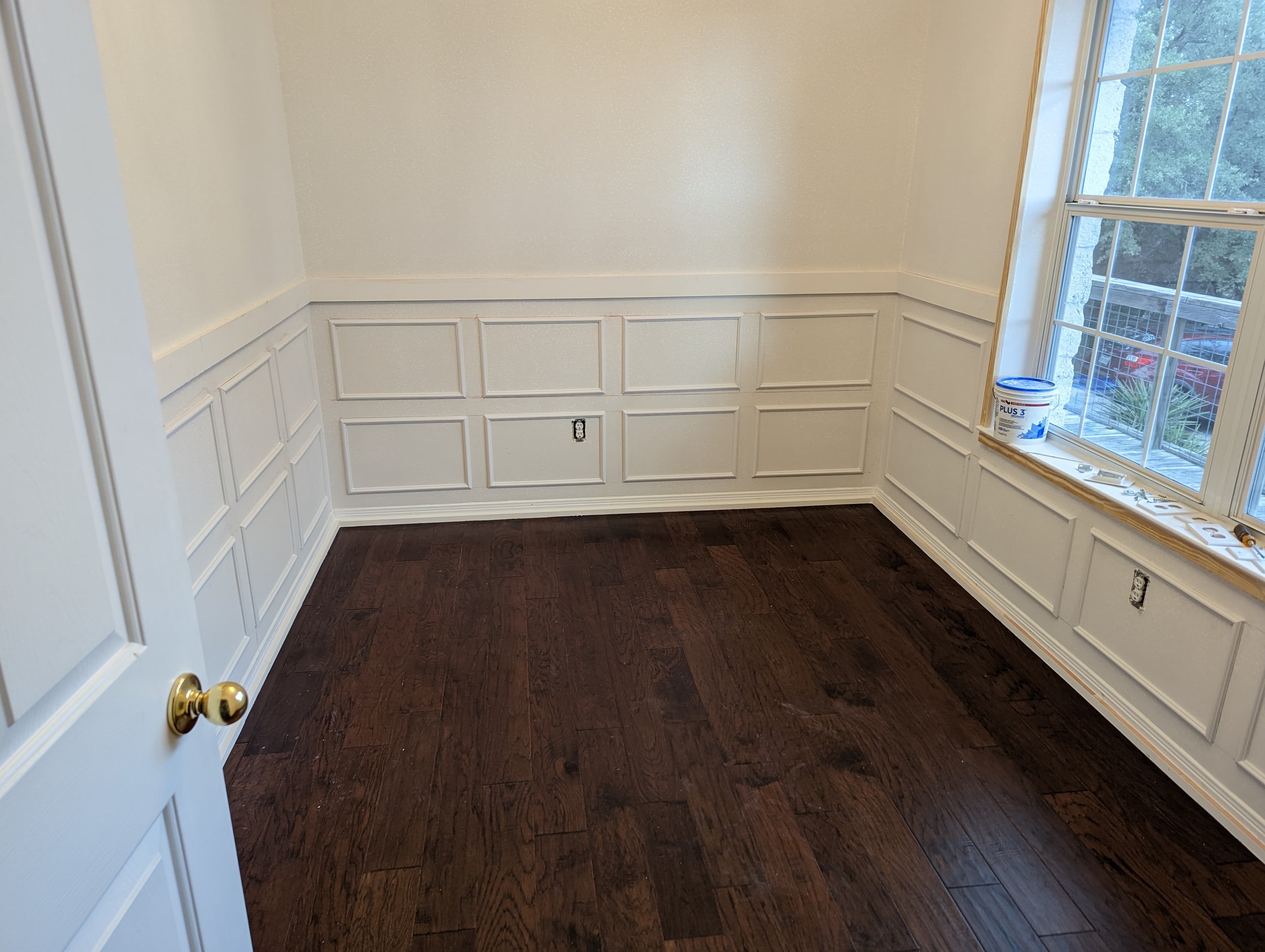 Custom wainscoting paneling installation in dining room - San Antonio carpentry
