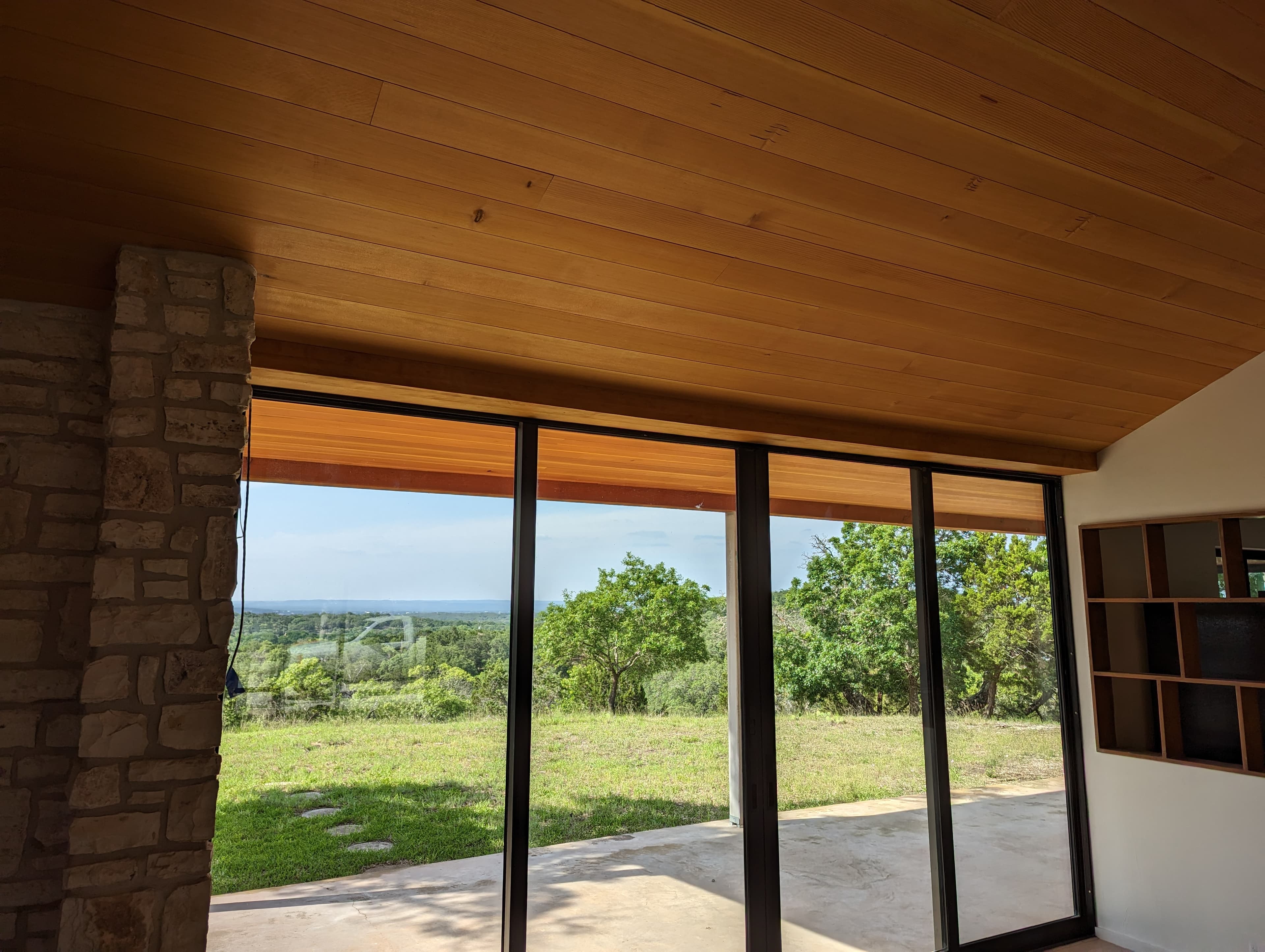 Custom wood ceiling installation with Hill Country view - San Antonio carpentry