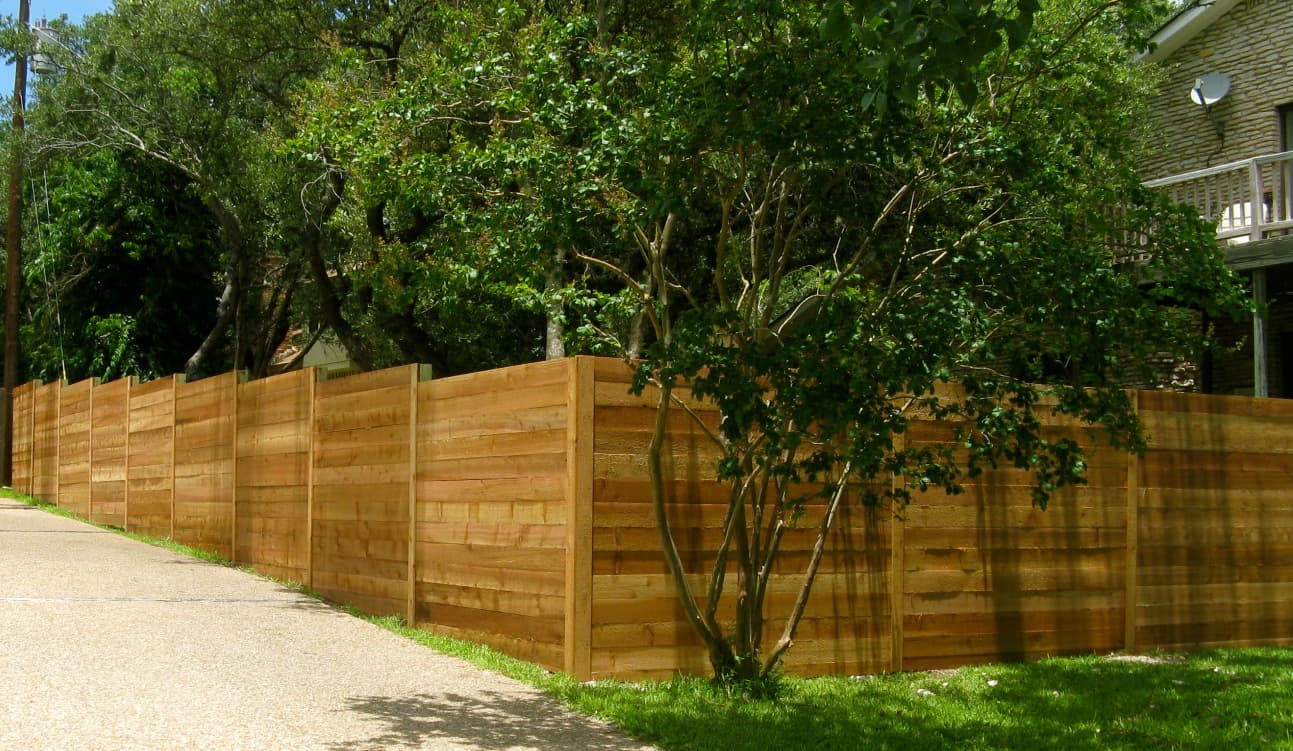 Professional fencing project featuring horizontal cedar fence traditional neighborhood