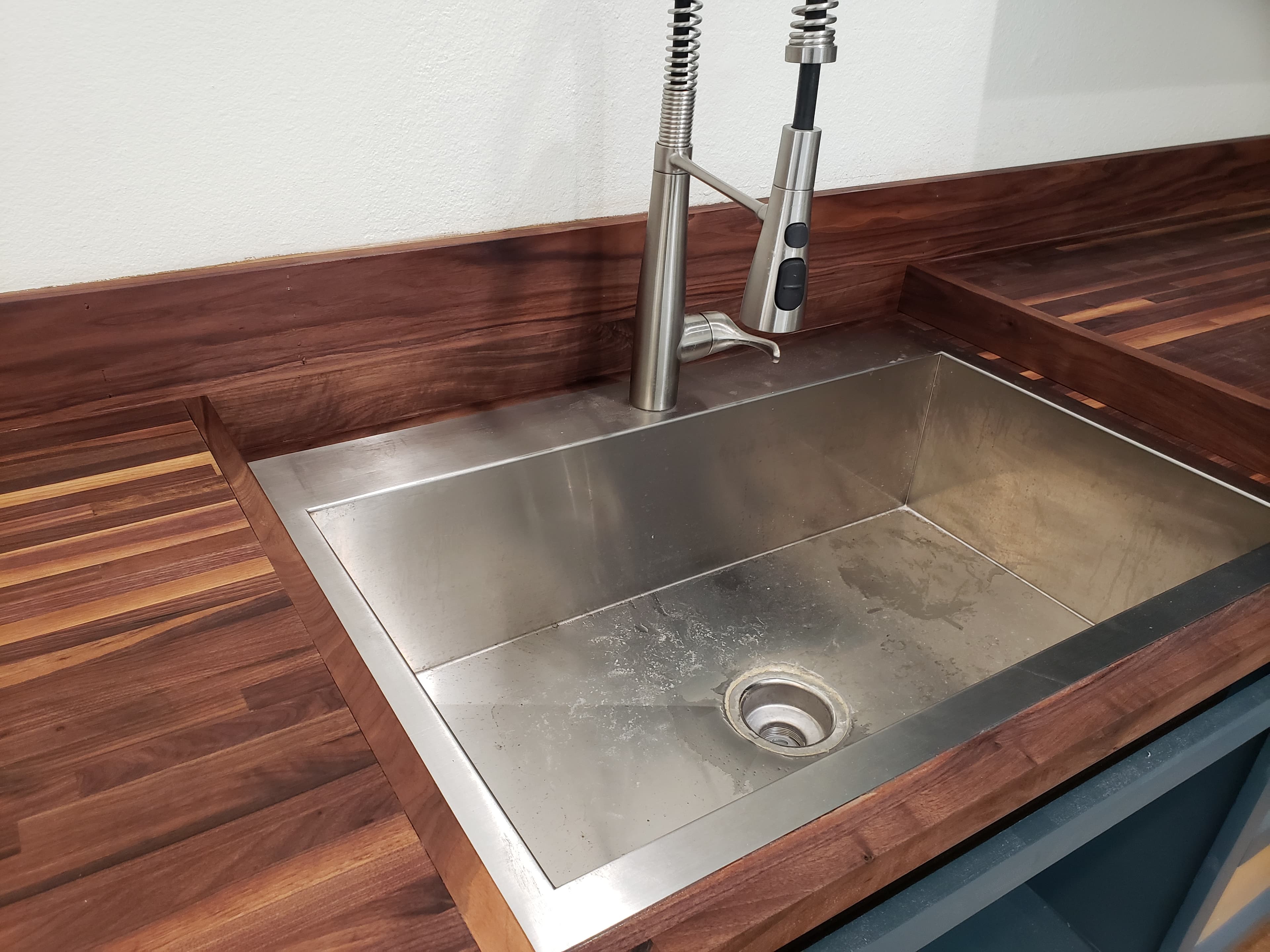 Professional kitchen remodel project featuring custom walnut countertop undermount sink kitchen