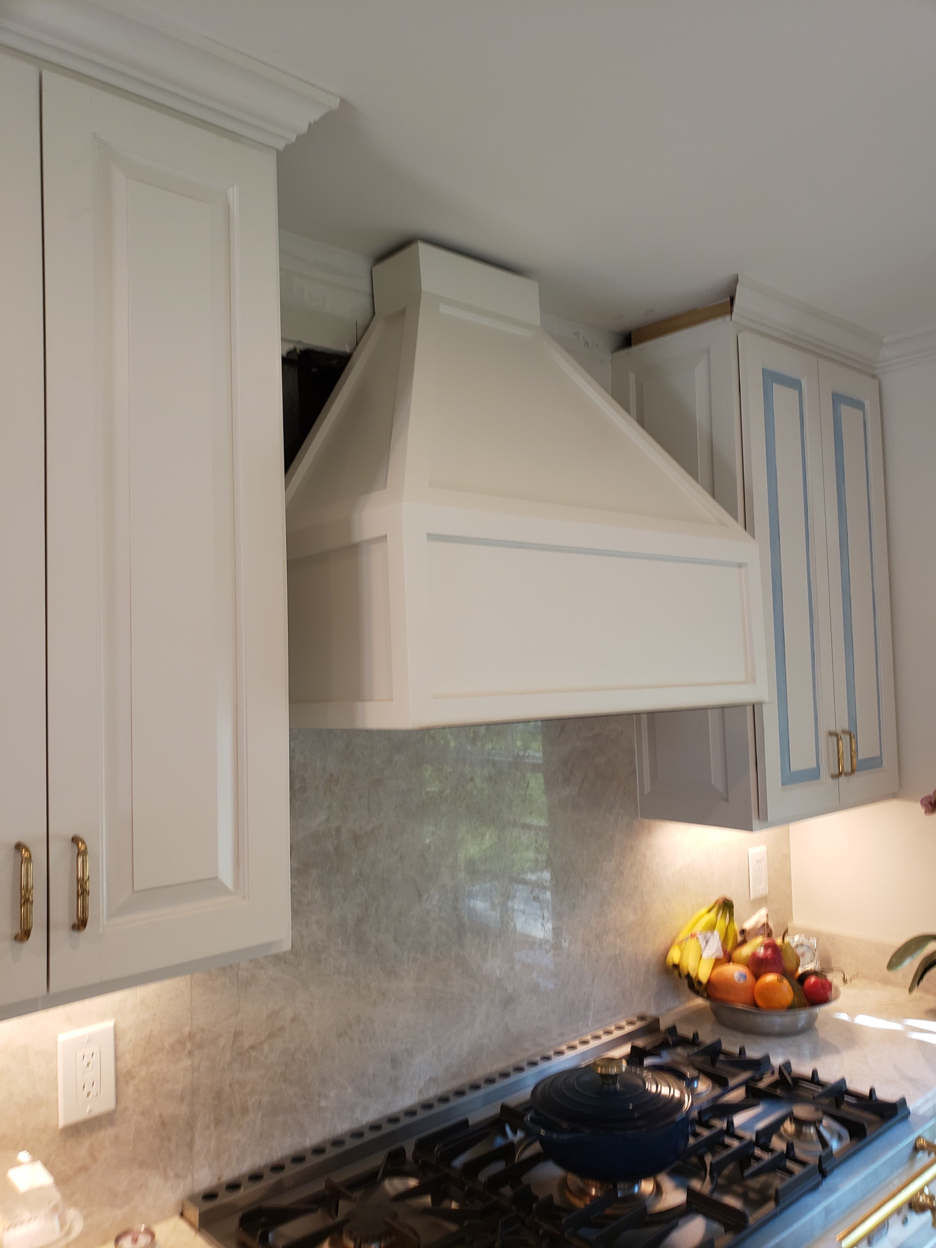 Professional kitchen remodel project featuring traditional white kitchen cabinets raised panel doors