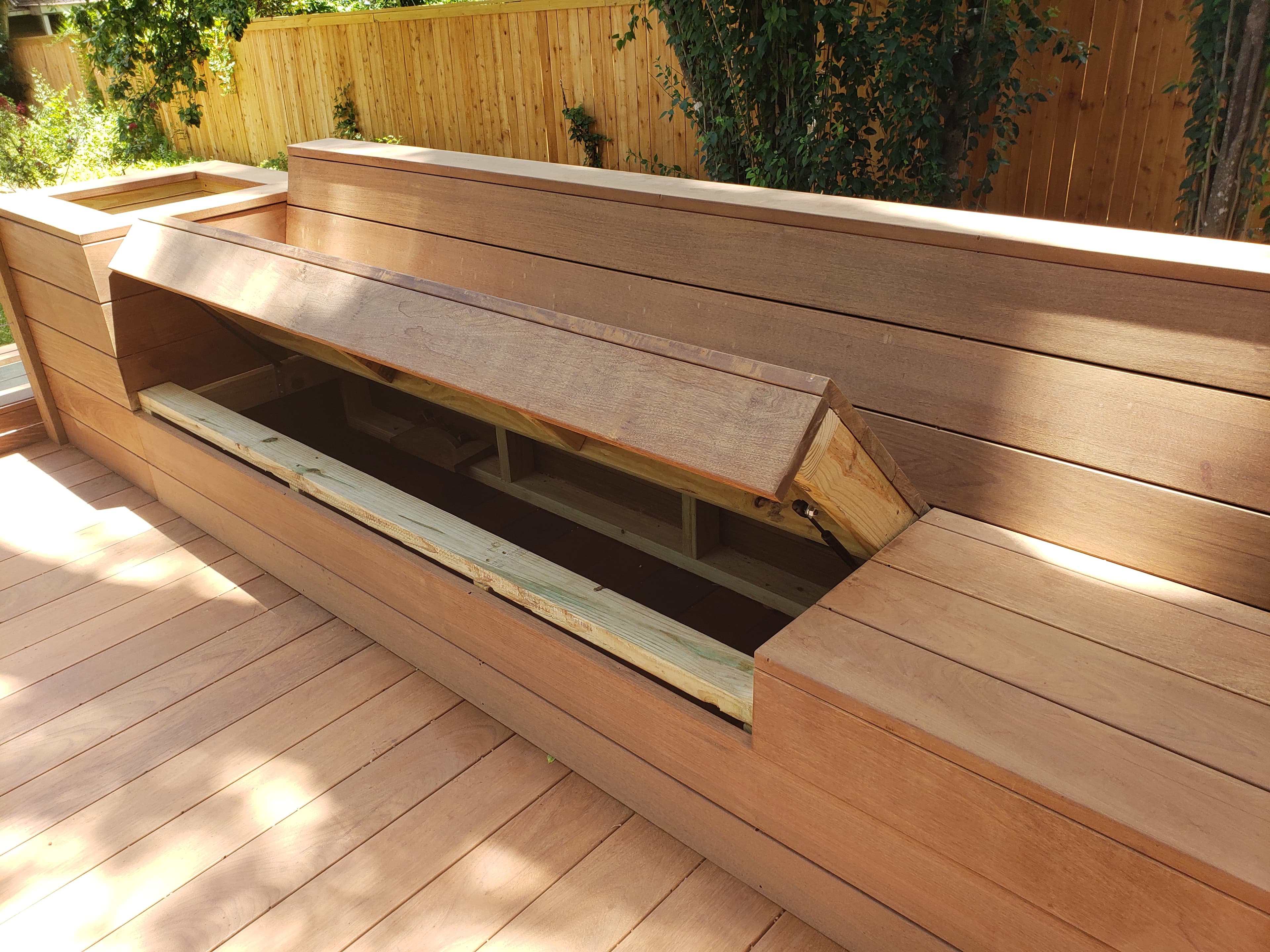 Professional outdoor living project featuring Ipe deck bench with hidden storage