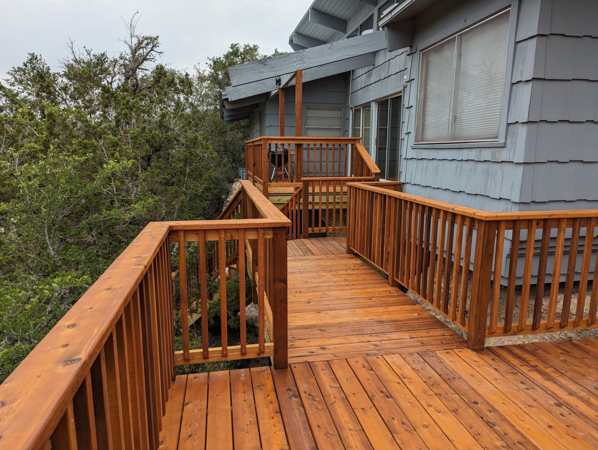 Professional outdoor living project featuring cedar deck multi level hill country overlook