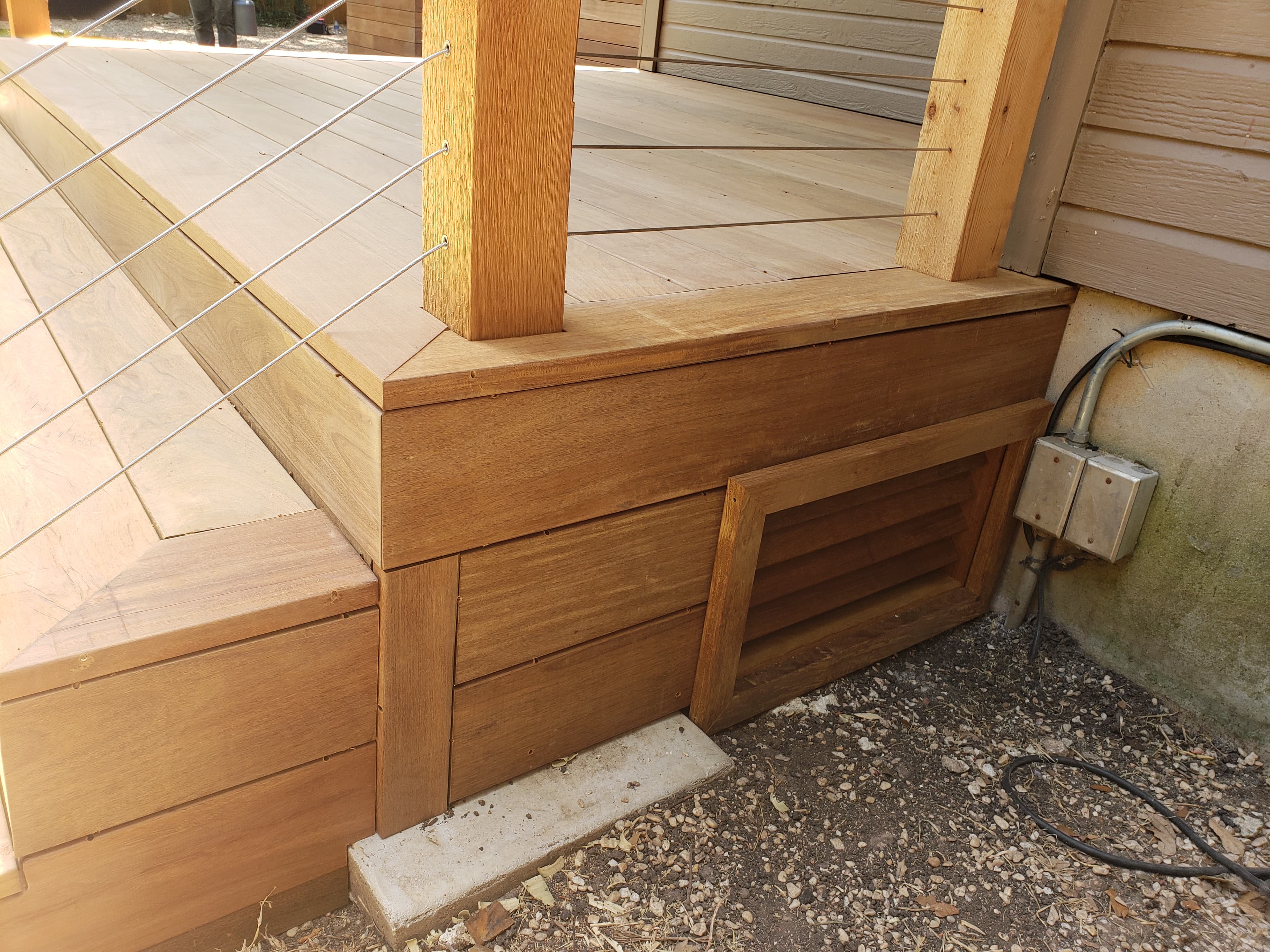 Professional outdoor living project featuring cedar deck skirting detail construction