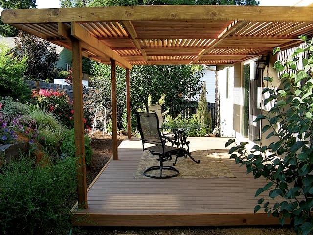 Professional outdoor living project featuring checker pergala w deck