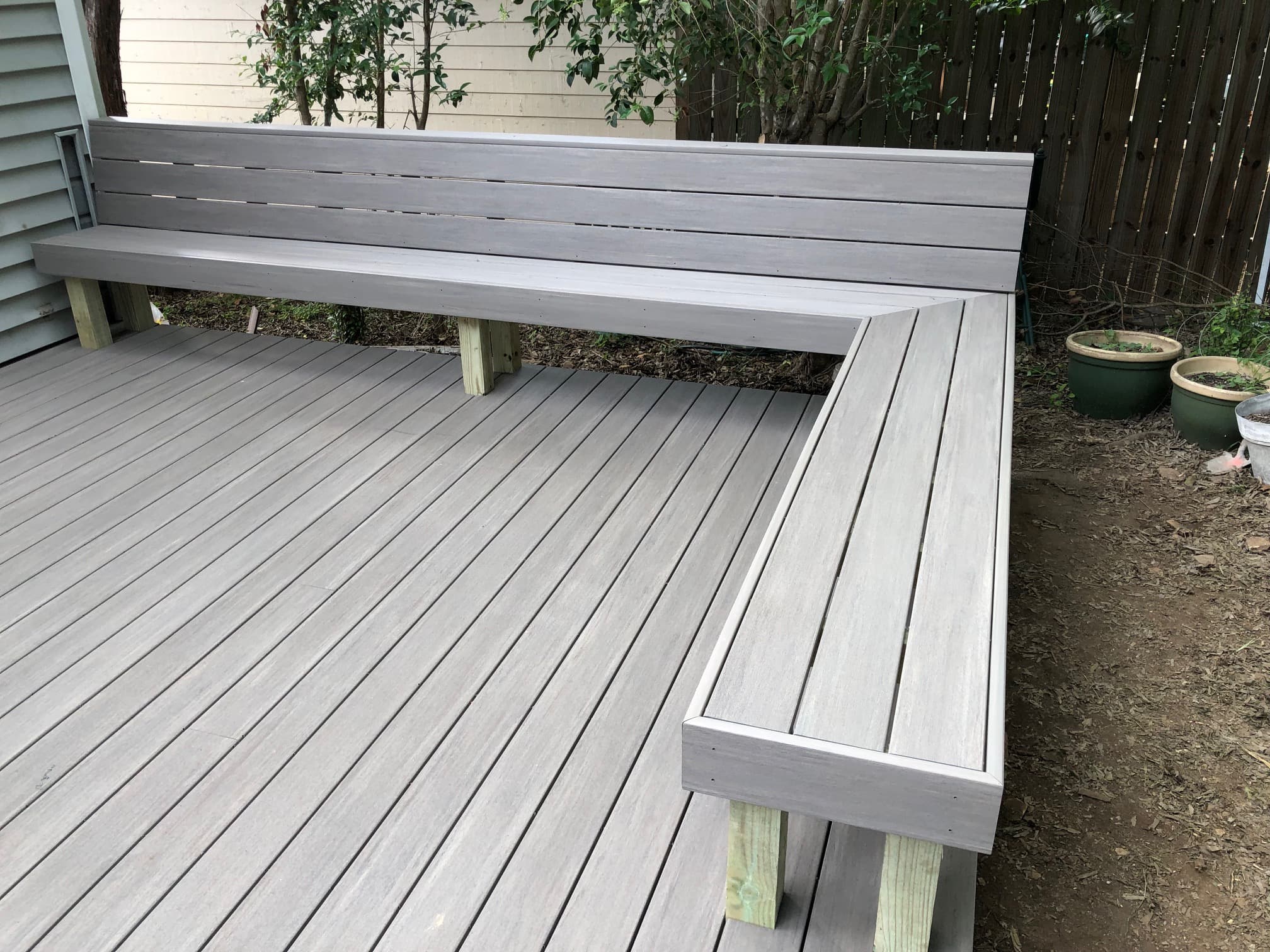Professional outdoor living project featuring composite deck with built in bench