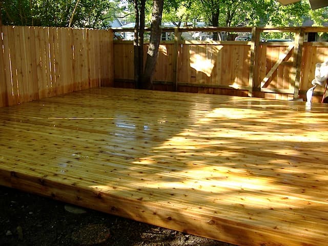 Professional outdoor living project featuring deck and fence 1
