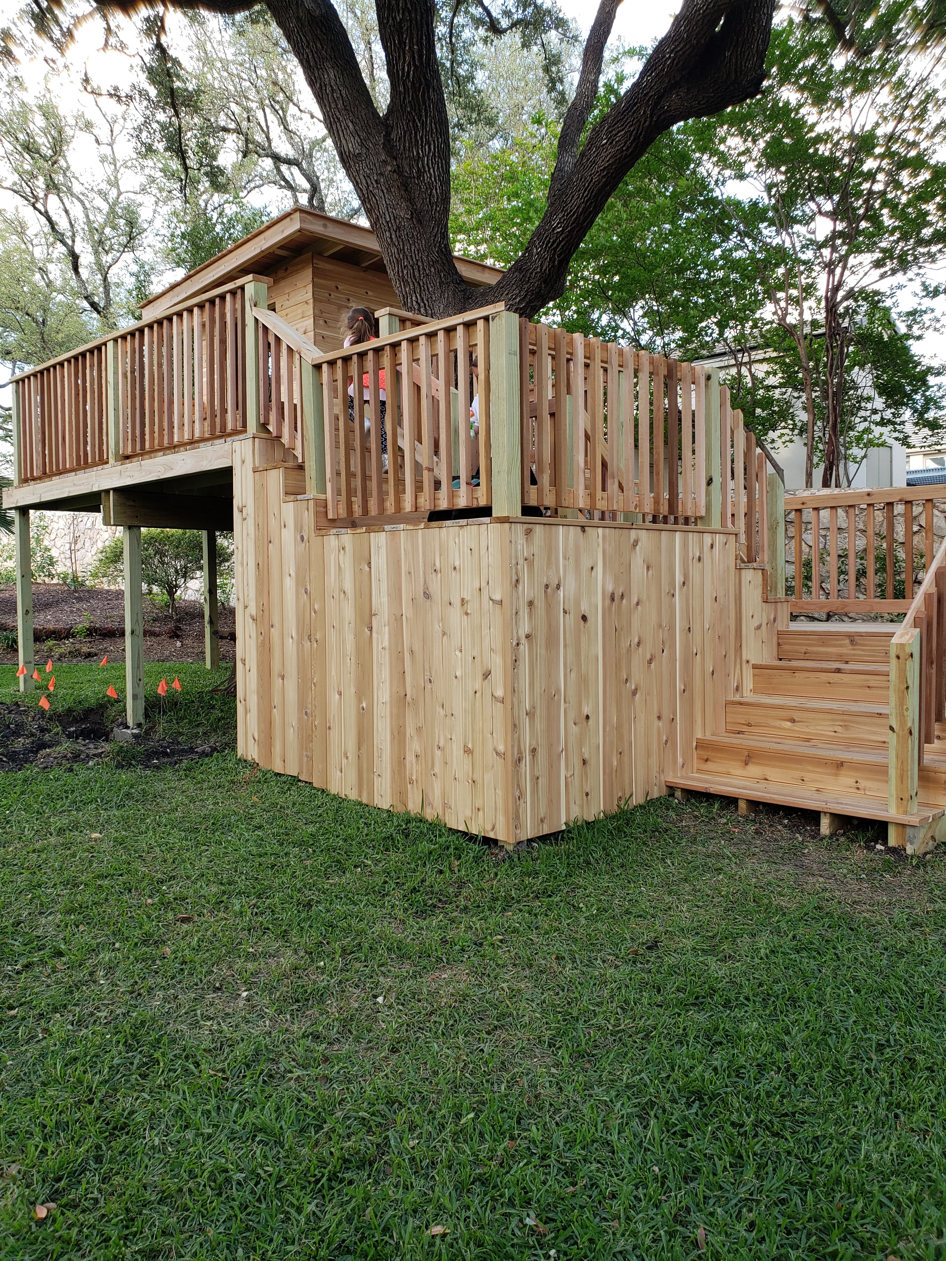 Professional outdoor living project featuring elevated deck with cedar privacy skirting