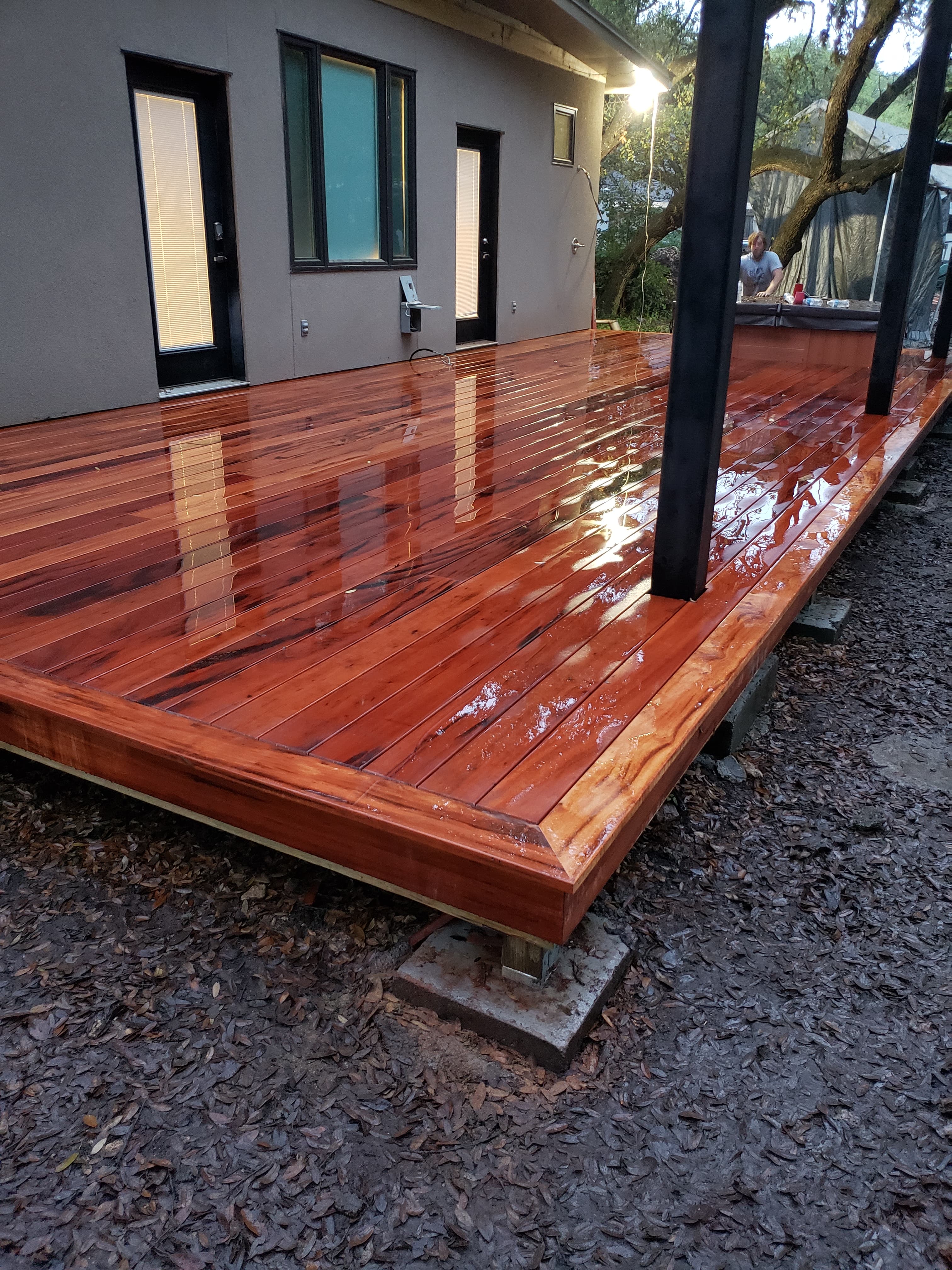 Professional outdoor living project featuring ipe deck construction in progress