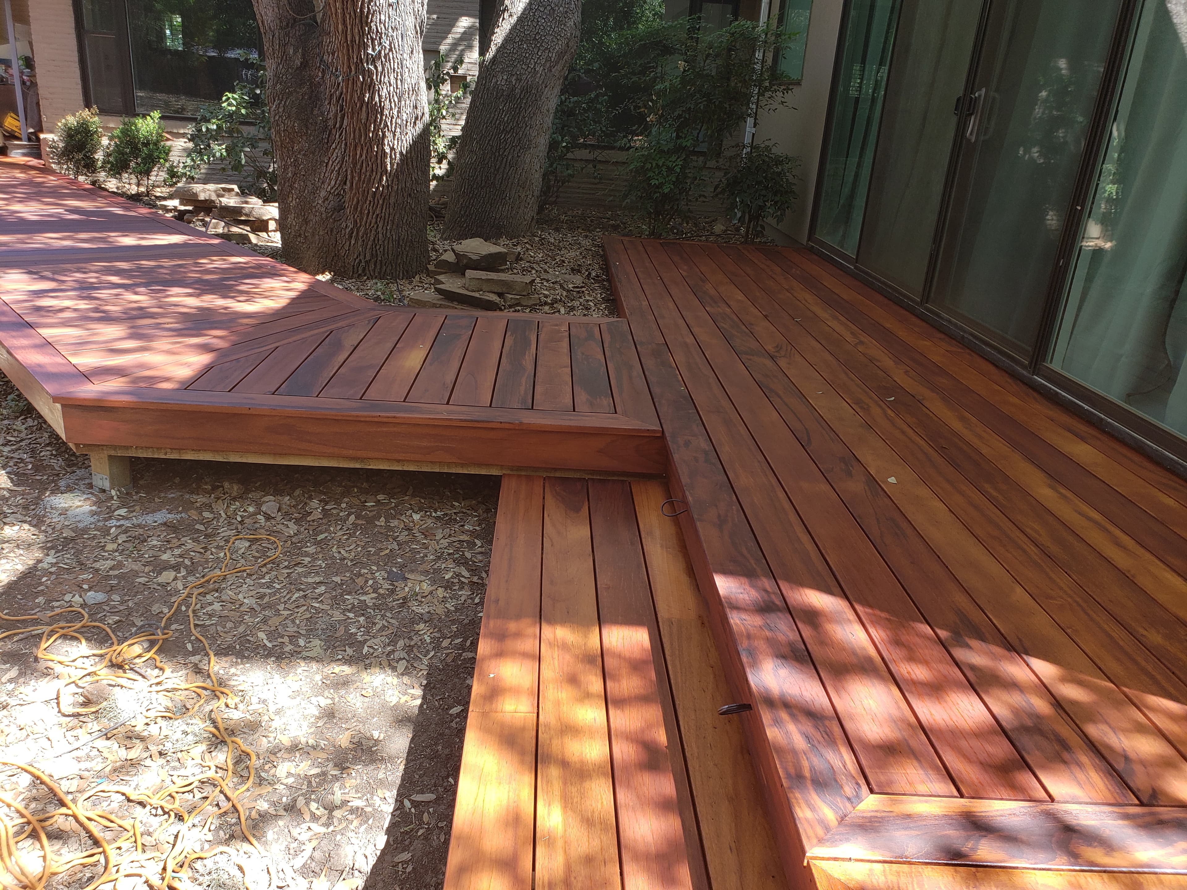 Professional outdoor living project featuring ipe deck l shaped design