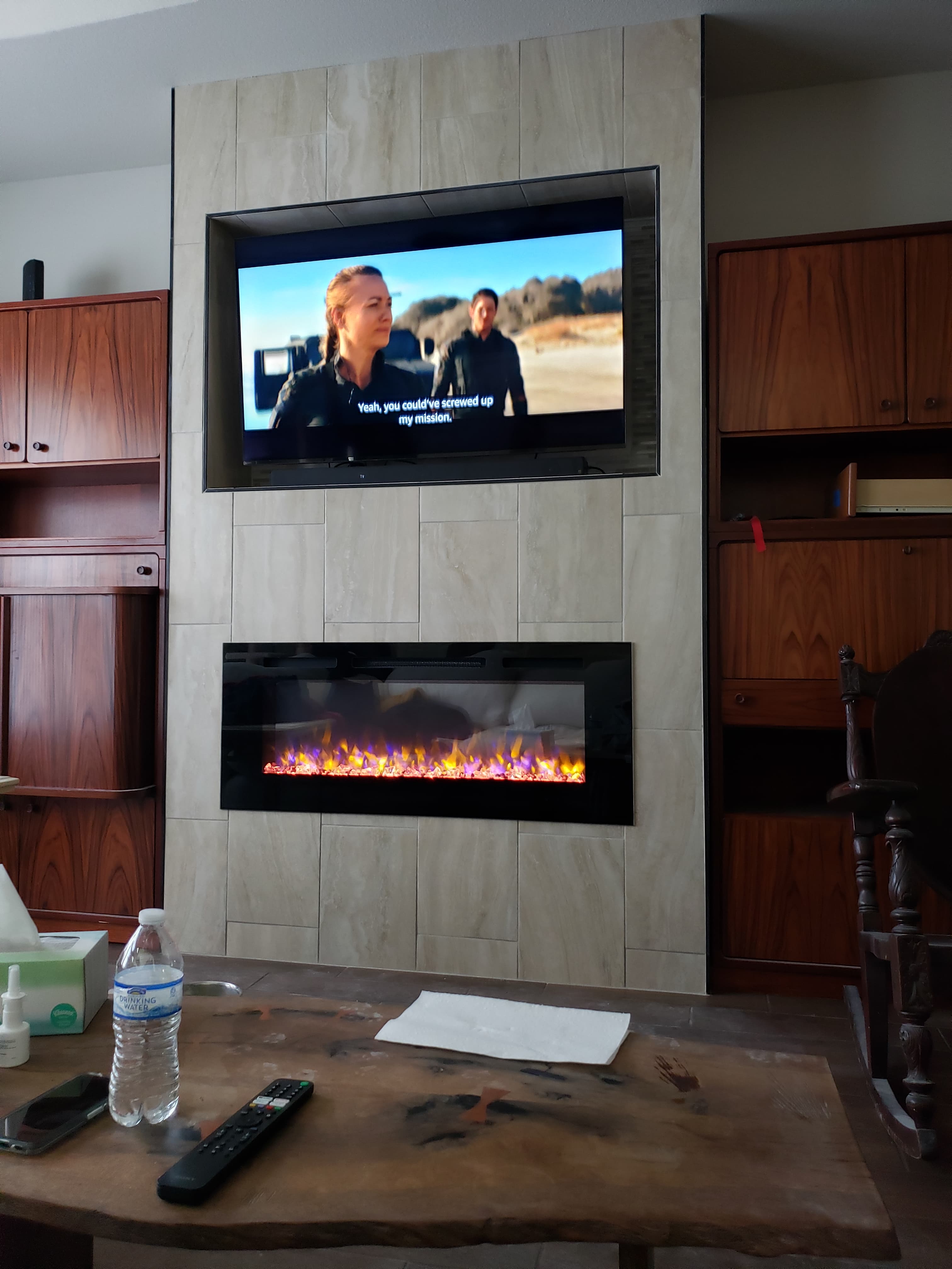 Professional whole home remodel project featuring custom entertainment center fireplace surround walnut