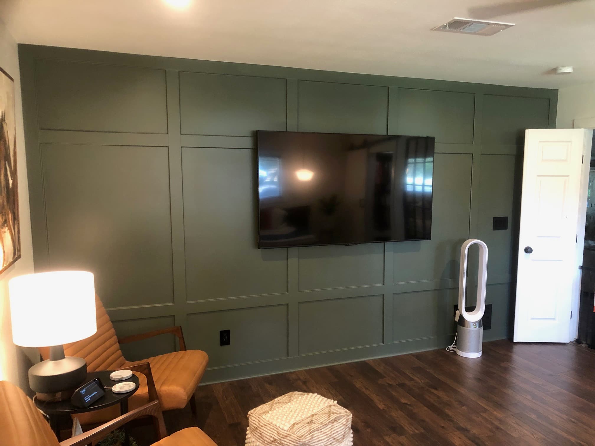 Custom entertainment center with green paneling by DH Construction San Antonio