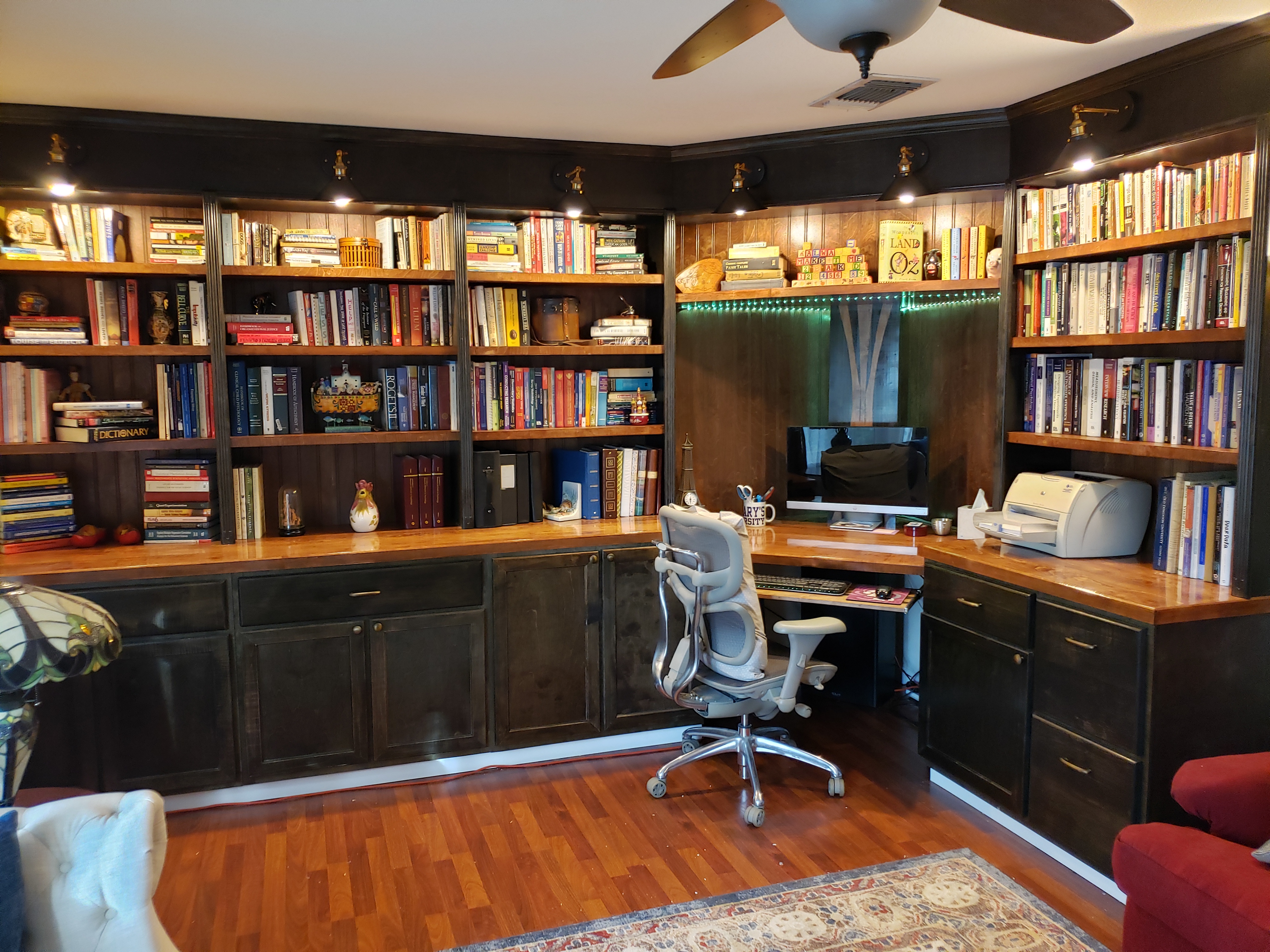 Custom built-in library with desk, featuring elegant shelving and storage